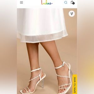 White sculpted heel/sandal. Bride